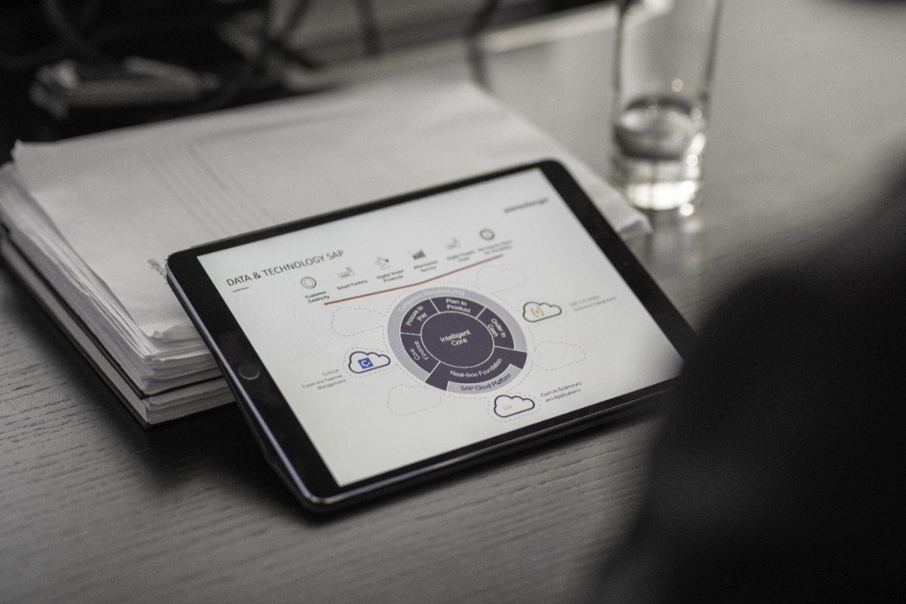 Close-up of manager working on tablet computer screen, CRM, SAP