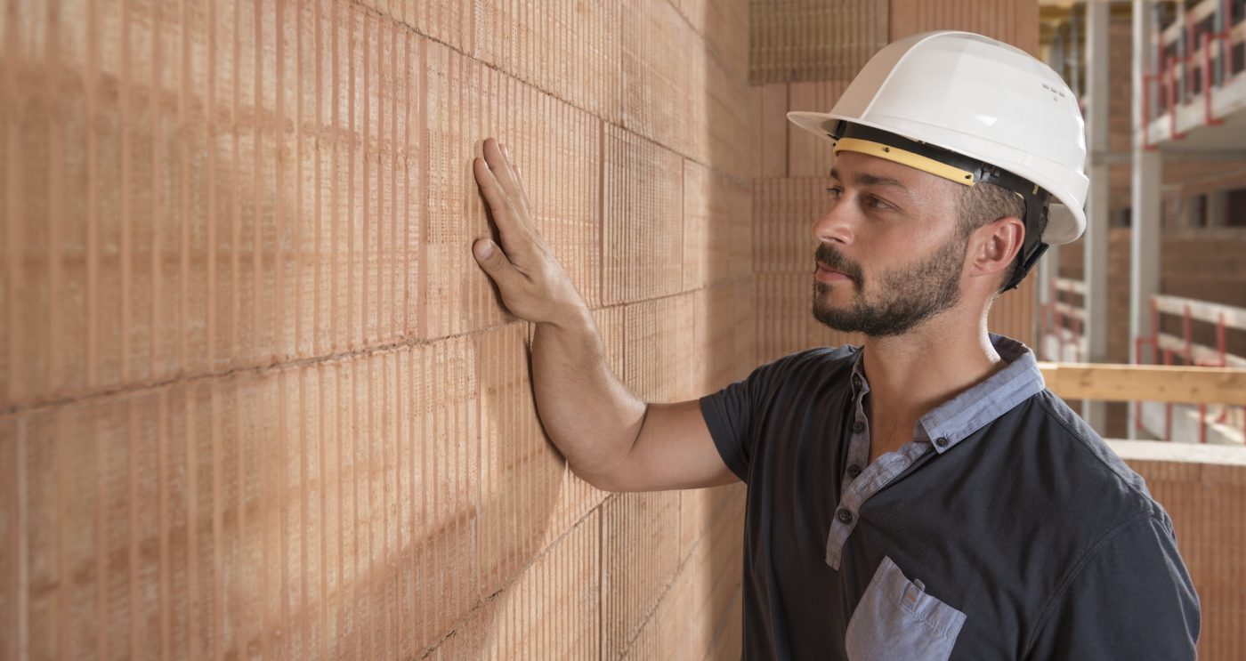 Building professional touching brick block wall